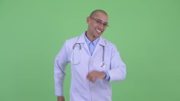 Happy Bald Multi Ethnic Man Doctor Dancing