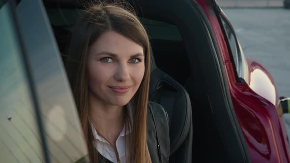 Portrait Charming Woman Sitting Inside Charging Electric Car