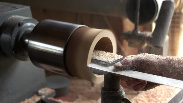 Carpenter Working with Woodworking Equipment