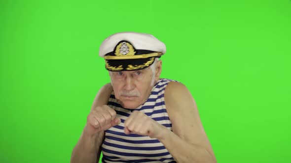 Elderly Sailor Man Is Angry and Shows a Fists. Sailorman on Chroma Key