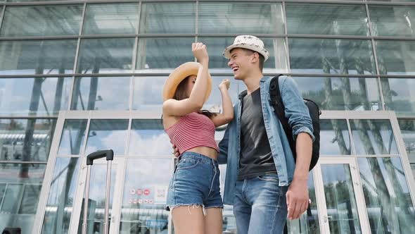 Travel. Happy Couple Hugging, Traveling At Airport