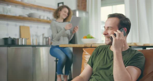 Cheerful Man Talking on Smartphone