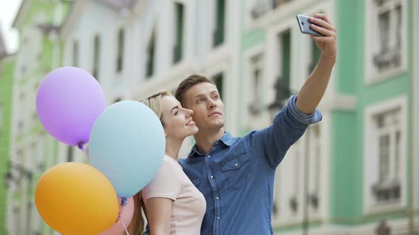 Girlfriend and Boyfriend Kissing in Street and Taking Selfie, Romantic Photos