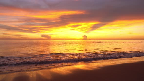 Tropical sea at sunset or sunrise over sea video 4K, The sun touches horizon, Red sky in golden hour