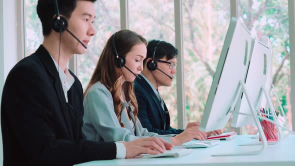 Business People Wearing Headset Working in Office