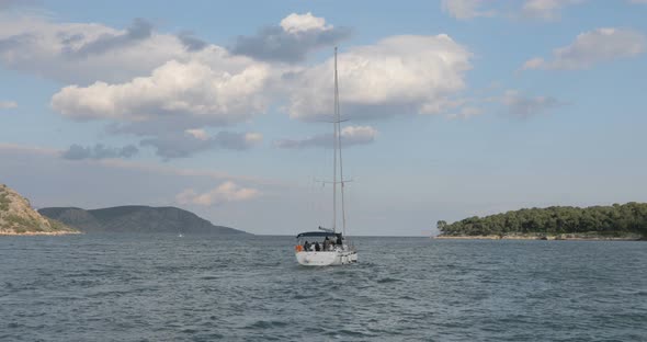 White Boat with Mast Sailing to the Open Sea