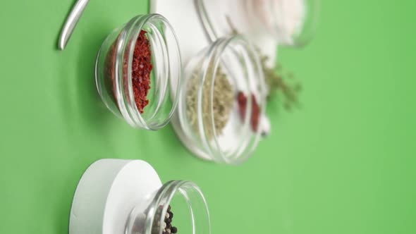 Vertical video: Italian spices on green background