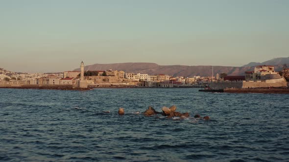 Flying low towards Chania harbor in Greece