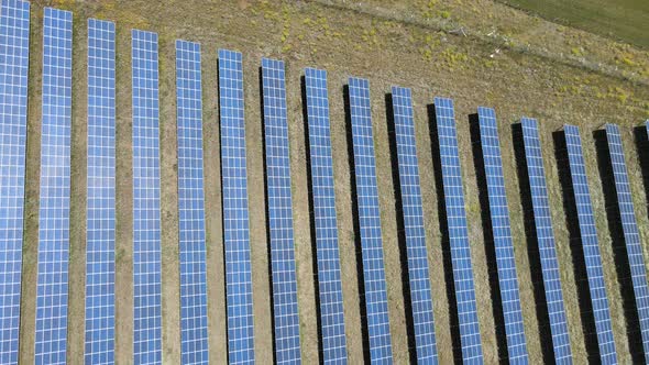 Drone fly over solar farm, renewable energy from solar.