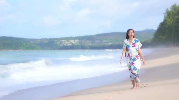 Asian woman enjoy around beautiful beach sea ocean