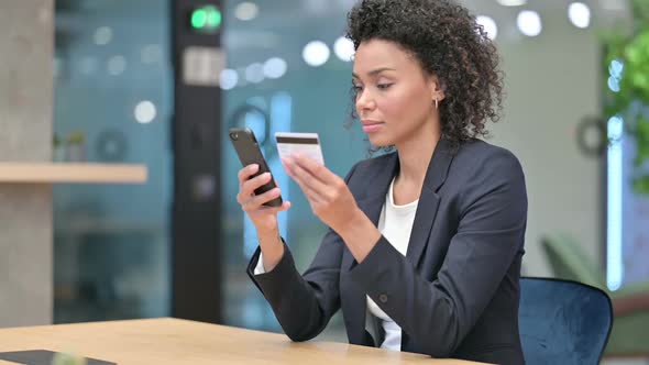 African Businesswoman Shopping Online on Smartphone