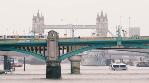 Southwark and Tower Bridges in rainy weather, London, United Kingdom. The bridge in the foreground i