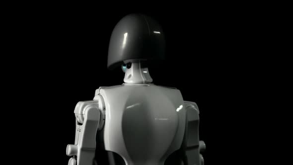 Robot Revolves Around Itself. Black Background