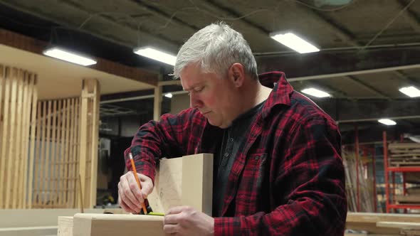 Carpenter at work in woodshop