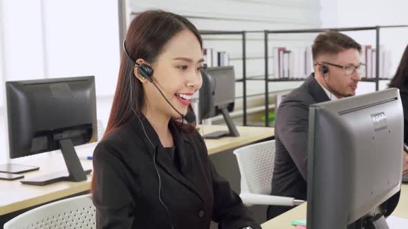 Business People Wearing Headset Working in Office