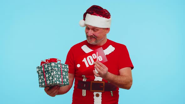 Man in Red Christmas Tshirt Showing Gift Box and 10 Percent Discount Inscriptions Banner Text Note