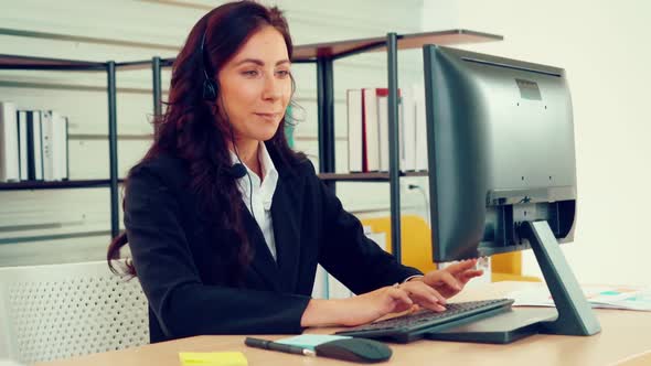 Business People Wearing Headset Working in Office