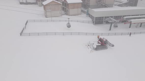 Flying over rope-way with gondolas at mountain resort Crystal Park in Bakuriani. Snowy winter day.