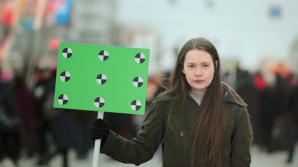 Serious Girl with Blank Poster Copyspace. Empty Banner. Placard Copy Space