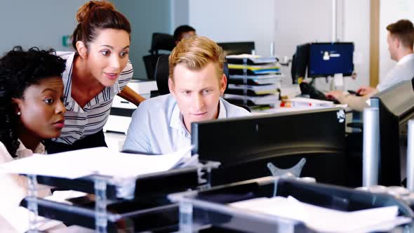 Executives working together at the desk q