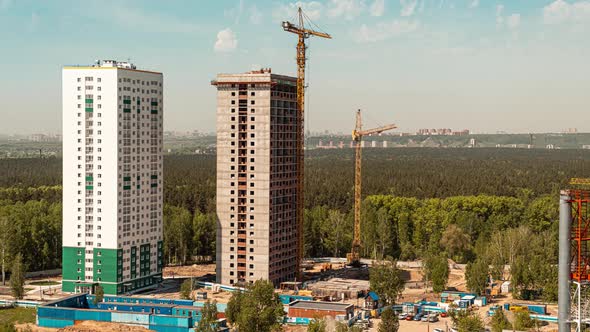 Construction Site with Big Tower Crane in Time Lapse Under Construction Concept. Timelapse