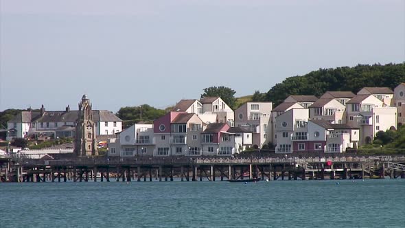 Victorian wooden pier stretching out to sea in the seaside town of Swanage in the English county of