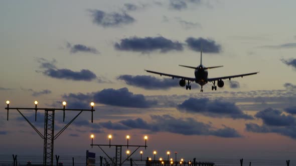 Commercial Plane Jet Landing Sunset