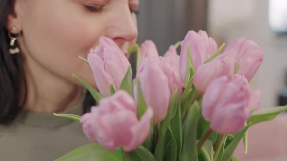 Beautiful Woman Smelling Flowers