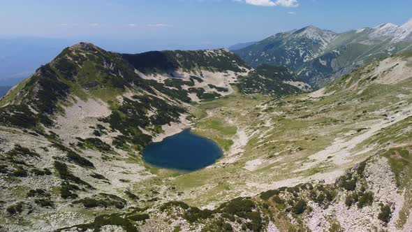 Aerial View of a Lake in the Pirin Mountains with Blue Clear Water