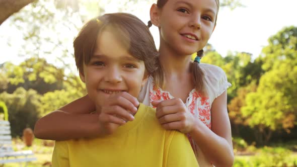 Pretty little girl embracing a little boy