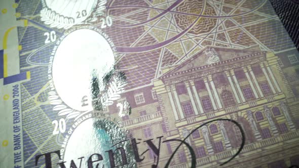 Fifty British Pound paper banknote in close up macro view dolly shot.