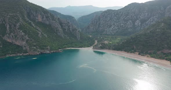 Aerial Drone of Cirali Beach and Olympos Olimpos Mountain in a Beautiful Day Light