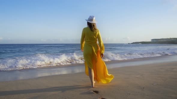 Silhouette Woman at Sunset Observing Ocean Waves Crashing on Beach Spraying 6K