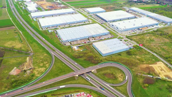 Aerial view of goods warehouse. Logistics center in industrial city zone from above. Aerial view of