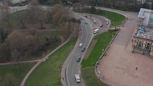 Descending drone shot of busy narrow road through alexandra palace London