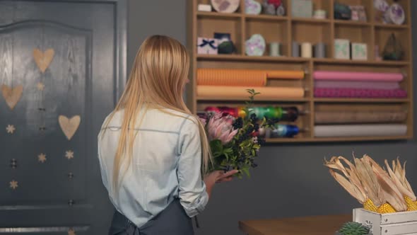 Young Attractive Florist Starting to Arrange Modern Bouquet in the Flower Shop Young Handsome