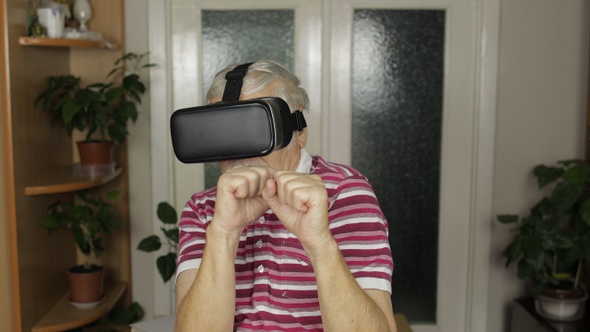 Grandmother in Virtual Headset Glasses Watching Video in VR Helmet Training Box, Shows Fist Fight