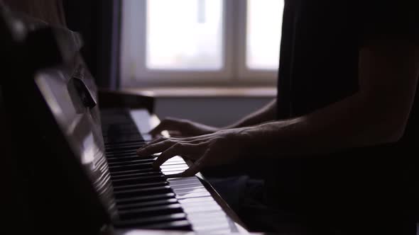 Closeup of Pianist's Hands Practicing to Play the Piano at Home