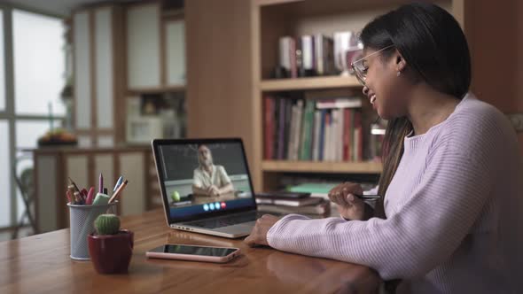 Female Black Latin Student Learning Watching Video Call with University School Teacher From Home