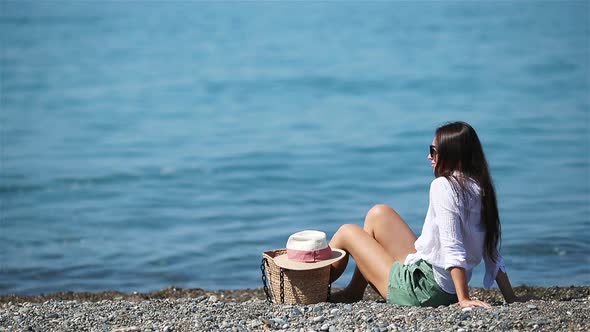 Young Woman in White on the Beach