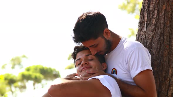 Happy Gay Couple Spending Time Together in Sunny Day in Green Park