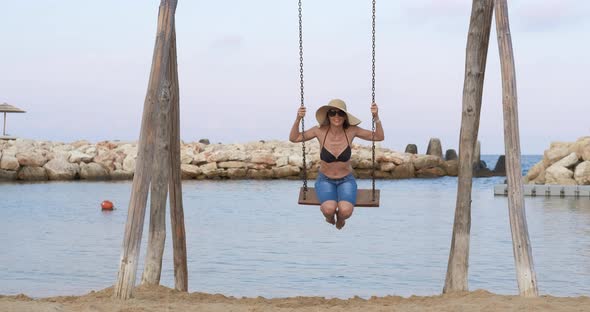 Tourist Relaxation on Swings