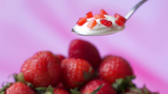 Close-up of Healthy Strawberry and White Yogurt on the Spoon, Concept of Healthy Food Nutrition