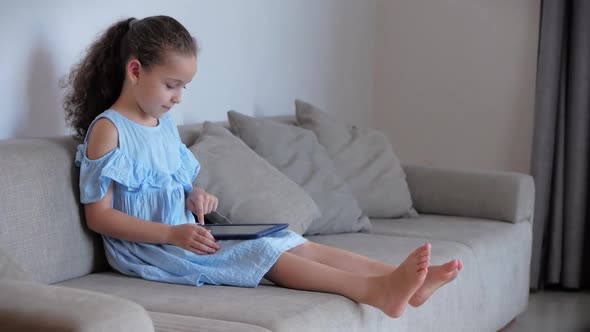 Happy Children Playing at Home Relaxing Use a Smartphone Cuddling Sit on Sofa Daughter and Son,look