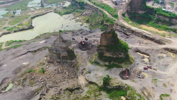 Aerial, machinery work in opencast sand mine Brown Canyon in Semarang Indonesia