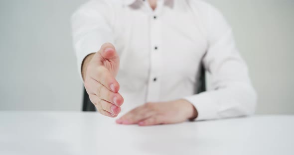 Man extends his hand for a handshake