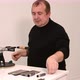 Man Shows a Master Class on Sharpening a Knife on a Machine - VideoHive Item for Sale