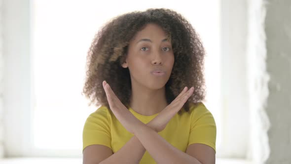 African Woman Denying with Arms Crossed