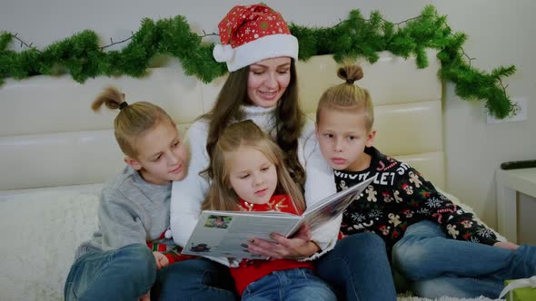 New Year's Atmosphere Mum Reads Book To His Family