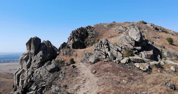 Pile Of Large Rocks Over Mountains Of Macin In Tulcea County, Dobrogea, Romania. Aerial Drone